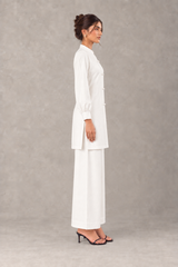 Side view of Pearl linen outfit showing straight-cut shirt